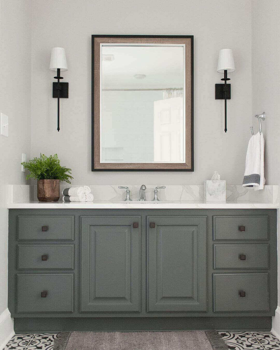 Bathroom sconces with shades.  Two sconces installed on either side of a single bathroom mirror.